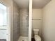 This bathroom has a walk-in shower with modern tile and new fixtures at 660 Thomasville Se Blvd, Atlanta, GA 30315