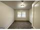 Bright bedroom with a large window, neutral paint and carpet at 660 Thomasville Se Blvd, Atlanta, GA 30315