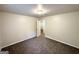 Spacious bedroom with neutral paint and carpet, featuring a ceiling light and doorway at 660 Thomasville Se Blvd, Atlanta, GA 30315