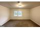 A bright bedroom with carpet flooring and a window at 660 Thomasville Se Blvd, Atlanta, GA 30315