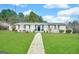 Charming single-story home featuring a well-manicured lawn and inviting walkway at 660 Thomasville Se Blvd, Atlanta, GA 30315