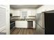 Modern kitchen featuring white cabinetry, stainless steel appliances, and granite countertops at 660 Thomasville Se Blvd, Atlanta, GA 30315