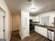 Well-lit kitchen featuring white cabinetry, stainless steel appliances and granite countertops at 660 Thomasville Se Blvd, Atlanta, GA 30315