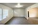 Sunlit living room featuring carpet flooring and neutral paint color at 660 Thomasville Se Blvd, Atlanta, GA 30315