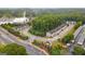 Aerial view of the community, showcasing landscaping, townhomes, and surrounding roads at 881 Whittington Sw Pkwy, Marietta, GA 30060