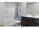 Bathroom featuring a shower-tub combo, white countertops and dark cabinets at 881 Whittington Sw Pkwy, Marietta, GA 30060