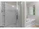 Bright bathroom with a large soaking tub and a glass-enclosed shower at 881 Whittington Sw Pkwy, Marietta, GA 30060