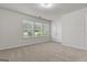 Spacious bedroom featuring neutral carpet and a row of windows letting in natural light at 881 Whittington Sw Pkwy, Marietta, GA 30060