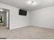 Bonus room featuring neutral carpet and a wall-mounted television at 881 Whittington Sw Pkwy, Marietta, GA 30060