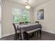 Bright dining area features hardwood floors, a large window, and a stylish light fixture at 881 Whittington Sw Pkwy, Marietta, GA 30060