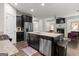 Open concept kitchen and living room with stainless steel appliances and granite countertops at 881 Whittington Sw Pkwy, Marietta, GA 30060