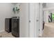 Modern laundry room featuring stainless steel washer and dryer at 881 Whittington Sw Pkwy, Marietta, GA 30060