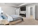 Comfortable main bedroom with plush carpet, a TV, and a doorway to the bathroom at 881 Whittington Sw Pkwy, Marietta, GA 30060
