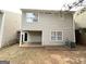 The backyard features a covered patio and spacious yard at 263 Coral Cir, Mcdonough, GA 30253