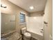 Bathroom featuring bathtub with shower, granite vanity, and wood-look flooring at 263 Coral Cir, Mcdonough, GA 30253