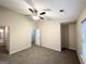 Cozy bedroom with neutral walls, ceiling fan, and carpet at 263 Coral Cir, Mcdonough, GA 30253