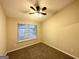 Bright bedroom featuring carpeted floors and natural light at 263 Coral Cir, Mcdonough, GA 30253
