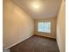 Neutral bedroom featuring carpeted floors and natural light at 263 Coral Cir, Mcdonough, GA 30253