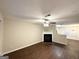 Spacious living room with a fireplace, hardwood floors, ceiling fan and an open floor plan at 263 Coral Cir, Mcdonough, GA 30253