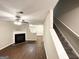 Inviting living room with a fireplace, hardwood floors, and staircase access at 263 Coral Cir, Mcdonough, GA 30253