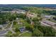 Scenic aerial view of the property surrounded by lush greenery and neighboring buildings in a charming neighborhood at 29 Indian Creek Rd, Locust Grove, GA 30248