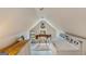 Attic with vintage sewing machine, washer and dryer, and wooden floors at 29 Indian Creek Rd, Locust Grove, GA 30248