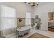 Traditional bathroom with clawfoot tub, classic fixtures, and neutral tones at 29 Indian Creek Rd, Locust Grove, GA 30248