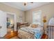 Bedroom with antique metal bed, connected to living area at 29 Indian Creek Rd, Locust Grove, GA 30248