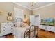 Charming bedroom featuring hardwood floors, dresser, and a cozy bed with ornate frame at 29 Indian Creek Rd, Locust Grove, GA 30248