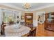 Classic dining room showcases hardwood floors, a table setting, and seamless flow into the living space at 29 Indian Creek Rd, Locust Grove, GA 30248