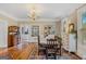 Formal dining room featuring a chandelier, hardwood floors, and elegant furnishings at 29 Indian Creek Rd, Locust Grove, GA 30248