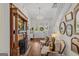 Charming entryway showcasing hardwood floors, a staircase, a chandelier, and a fireplace at 29 Indian Creek Rd, Locust Grove, GA 30248