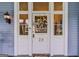 Close up of front door with welcome wreath and sidelights, showcasing the home's entrance at 29 Indian Creek Rd, Locust Grove, GA 30248
