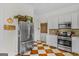 Bright kitchen with white cabinets, stainless steel refrigerator, and stainless steel appliances at 29 Indian Creek Rd, Locust Grove, GA 30248