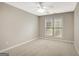 Neutral bedroom with carpet, ceiling fan, and window with blinds for comfortable living at 35 Wenham Ln, Sharpsburg, GA 30277