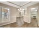 Dining room with view into adjacent kitchen area and natural light at 35 Wenham Ln, Sharpsburg, GA 30277
