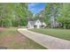 Suburban home with long driveway and ample green space at 35 Wenham Ln, Sharpsburg, GA 30277