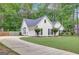 Suburban home with long driveway and manicured landscaping at 35 Wenham Ln, Sharpsburg, GA 30277