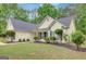 Inviting exterior showcasing manicured landscaping and classic architecture at 35 Wenham Ln, Sharpsburg, GA 30277