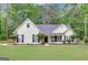 Charming single-Gathering home features a well-manicured lawn and classic architecture at 35 Wenham Ln, Sharpsburg, GA 30277