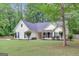 Attractive home with lush landscaping and a well-maintained lawn at 35 Wenham Ln, Sharpsburg, GA 30277