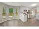 Eat-in kitchen boasts stainless steel appliances, a breakfast bar, and three sunny windows at 35 Wenham Ln, Sharpsburg, GA 30277