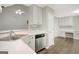 Well-lit kitchen with stainless steel appliances and adjacent workstation at 35 Wenham Ln, Sharpsburg, GA 30277