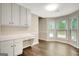 Bright eat-in kitchen area features desk space, cabinets and wooden floors at 35 Wenham Ln, Sharpsburg, GA 30277