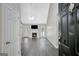 Bright living room with modern flooring, fireplace, and abundant natural light at 35 Wenham Ln, Sharpsburg, GA 30277