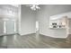 Spacious living area with vaulted ceilings, hardwood floors, and modern lighting at 35 Wenham Ln, Sharpsburg, GA 30277