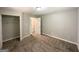 Spacious bedroom with neutral carpet, gray walls, and a closet for ample storage at 830 Mercury Dr, Atlanta, GA 30331