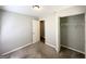Bedroom with carpeted floors, closet and neutral paint at 830 Mercury Dr, Atlanta, GA 30331