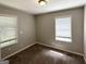 Bedroom featuring carpeted floors, natural light, and neutral paint at 830 Mercury Dr, Atlanta, GA 30331