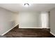 Spacious living room featuring wood-look flooring and neutral paint at 830 Mercury Dr, Atlanta, GA 30331